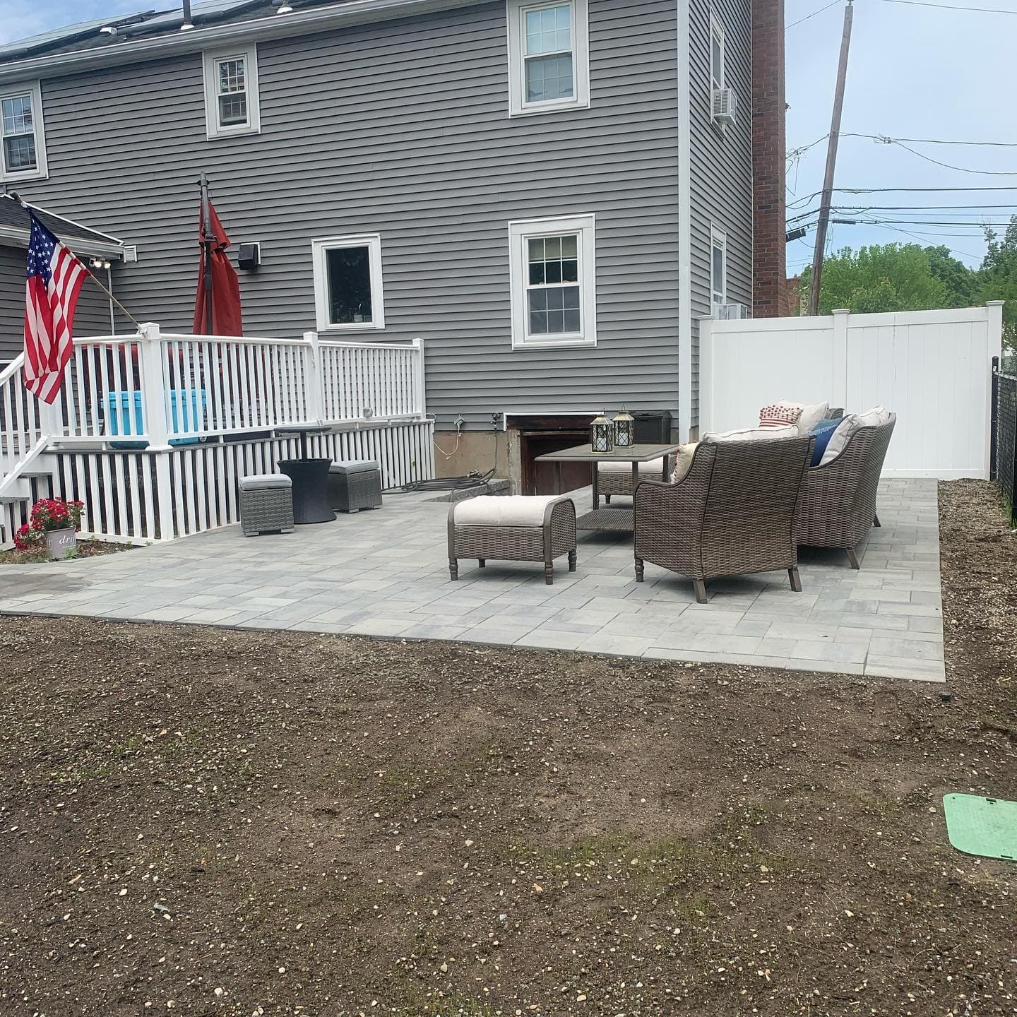 Backyard paver patio with furniture
