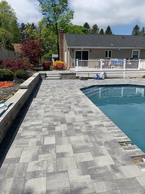 Paver deck along a pool