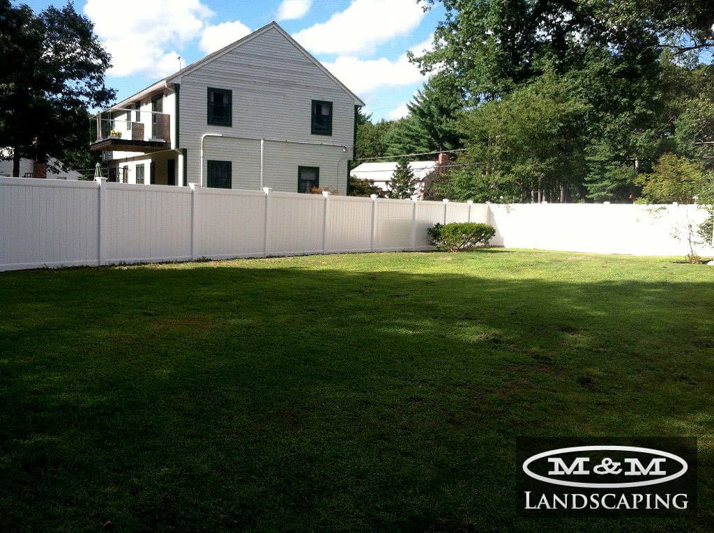 Vinyl fence around a lawn